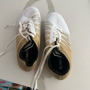 Gold and white spikes women’s 5.5